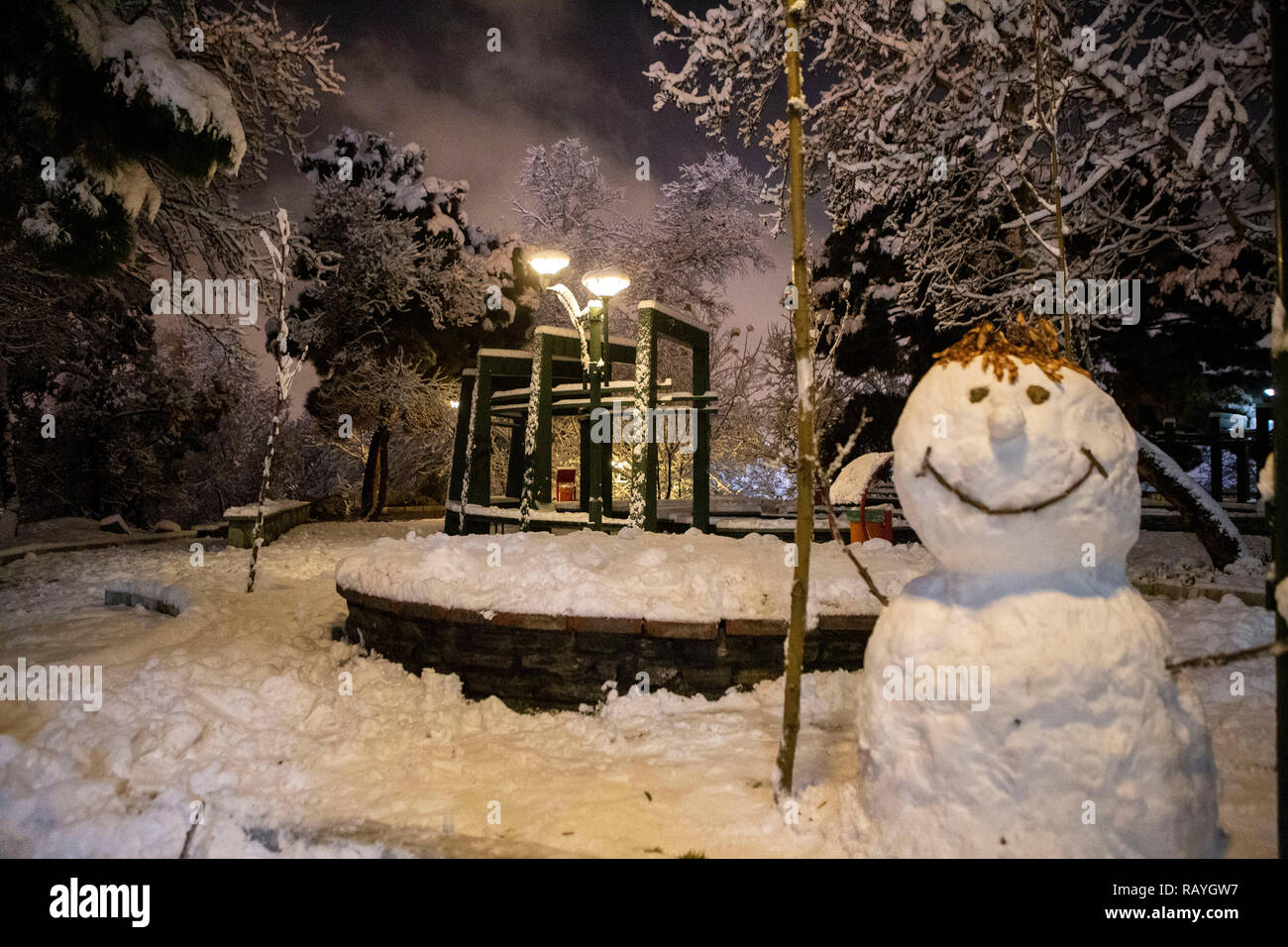 snowman in snowy night Stock Photo