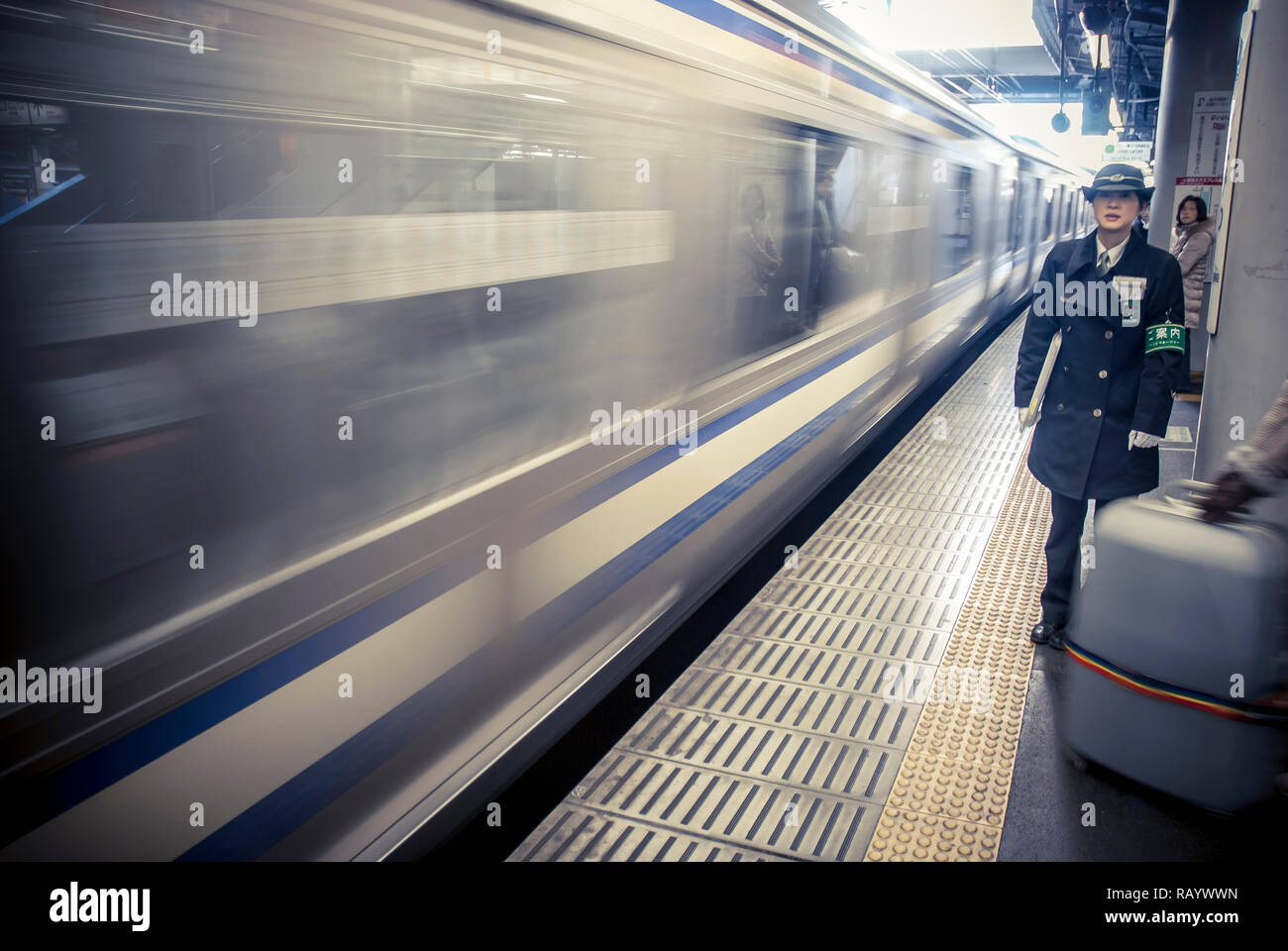 Woman officer on a platform of JR train station in Kamakura Stock Photo