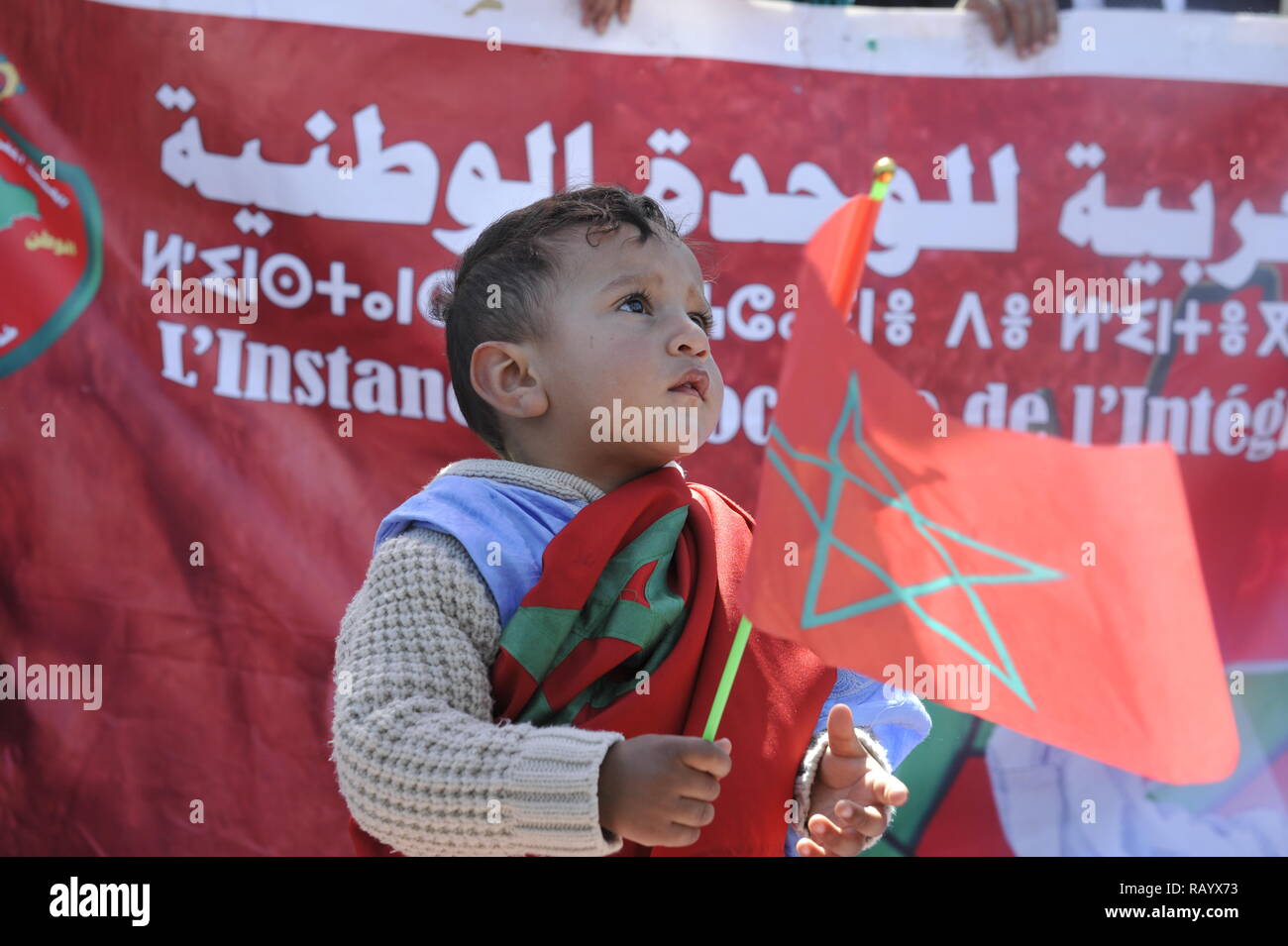 Moroccan child proudly carrying Moroccan flag - child from Moroccan Sahara. The photo was taken in Rabat on March 13, 2016 Stock Photo