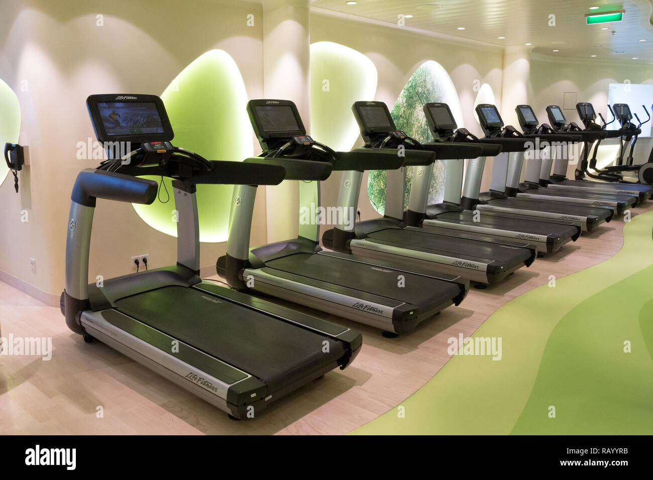 ROTTERDAM - NOV 24, 2016: Row of treadmills in the fitness center on board of a cruise ship. Stock Photo