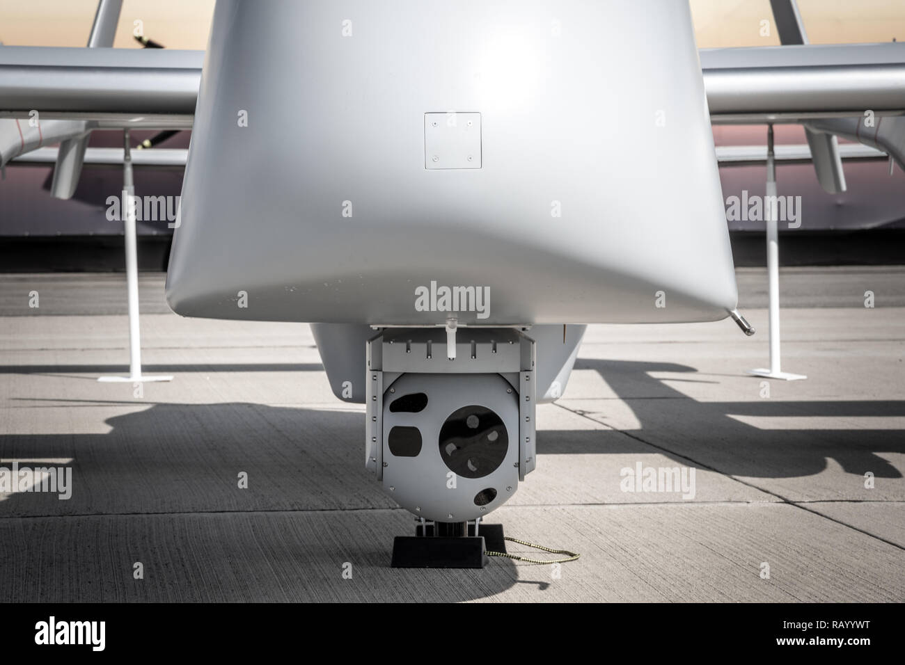 Multi-Sensor surveillance camera pod under a military drone. Stock Photo