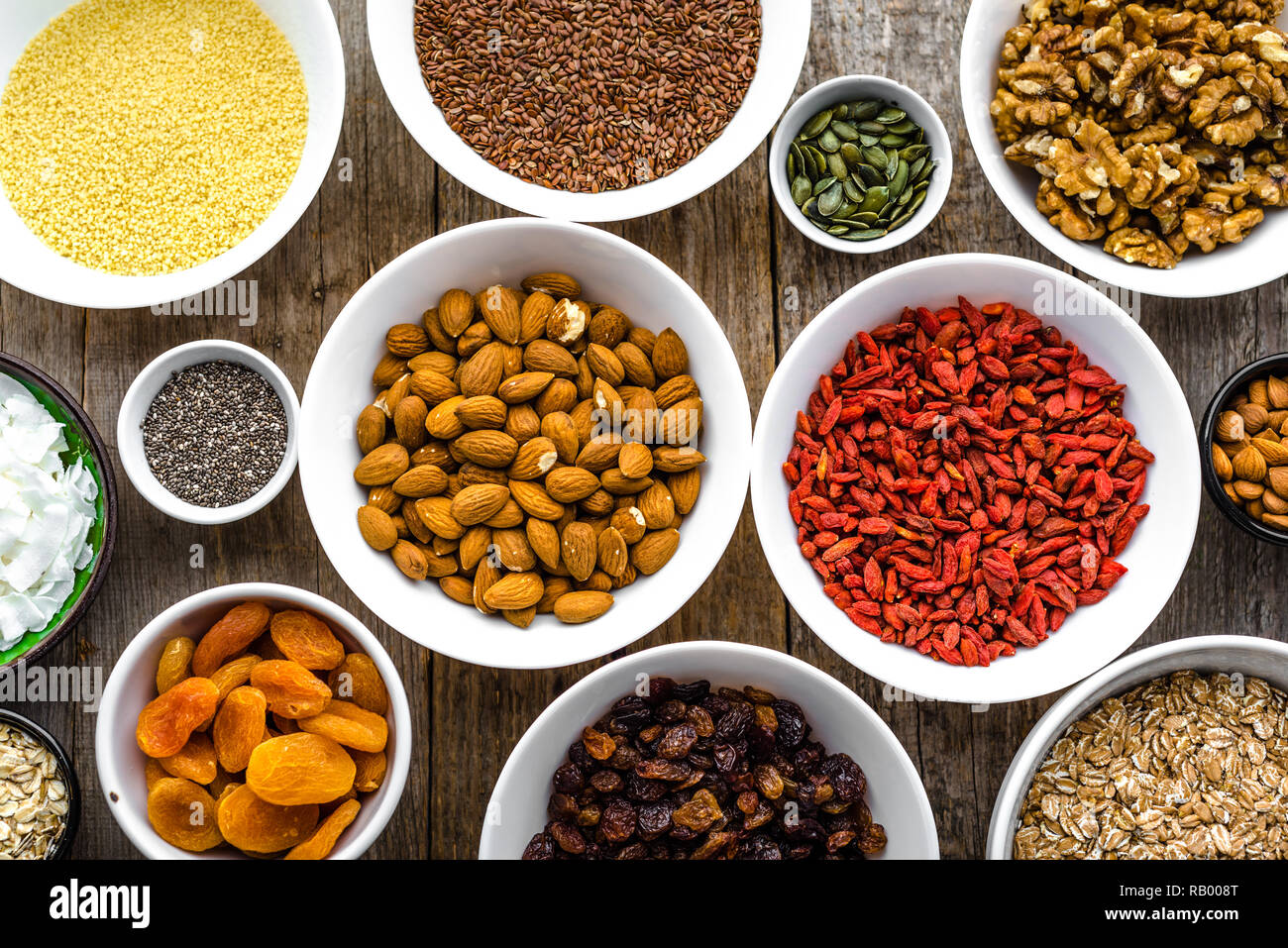 Table with food, selection of superfoods, fruits, berries, nuts, seeds