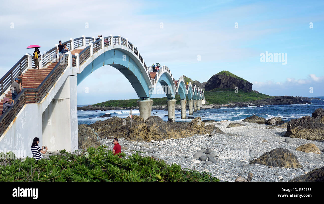 Taitung, Taiwan - Dec. 5, 2018 - Sanxiantai Dragon Bridge with tourist walking to Sanxiantai Island, Sanxiantai means platform of the three immortals. Stock Photo