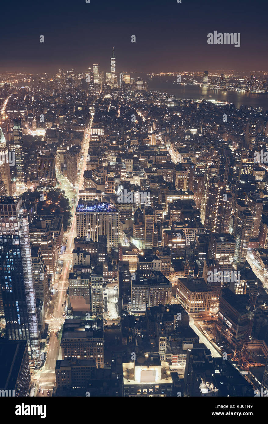 Aerial view of New York City at night, color toned picture, USA. Stock Photo