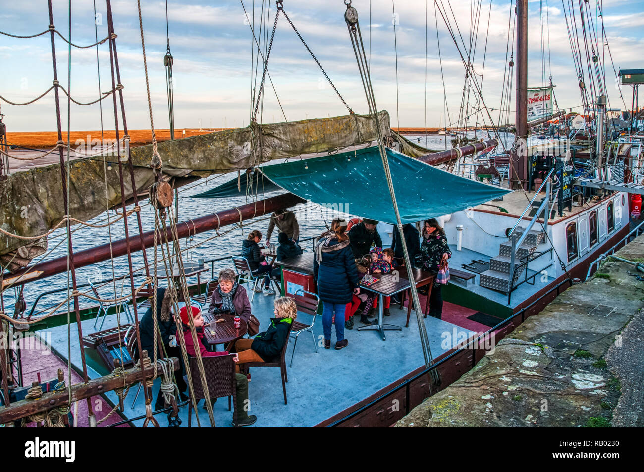 The Albatross, a 19th century Dutch sailing boat now moored at the quay in Wells-next-the-Sea as a restaurant and bar. Stock Photo