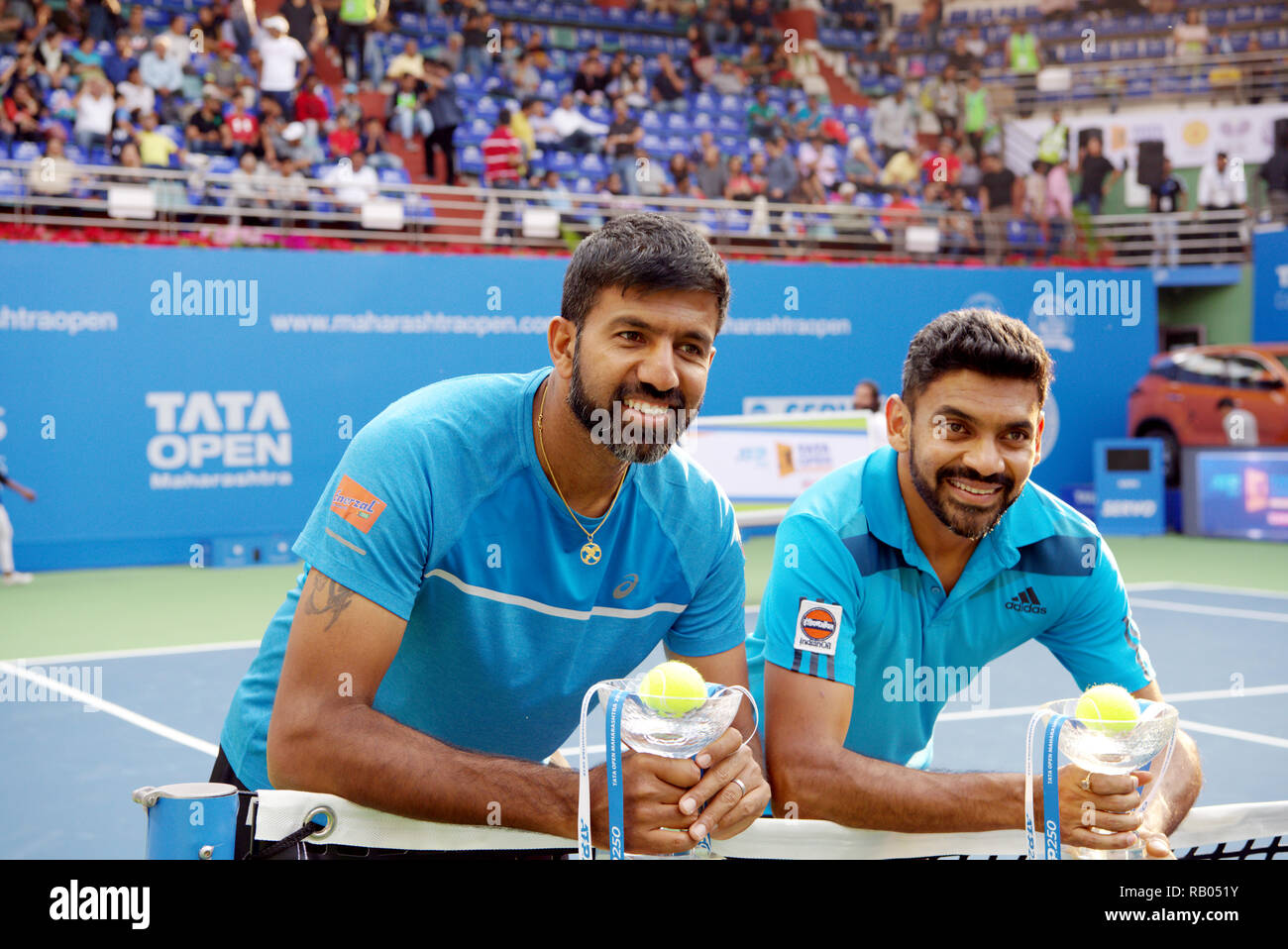 Pune, India. 5th January 2019. Rohan Bopanna and Divij Sharan, both of  India, pose with their doubles championship trophies won at Tata Open  Maharashtra ATP Tennis tournament in Pune, India. Credit: Karunesh