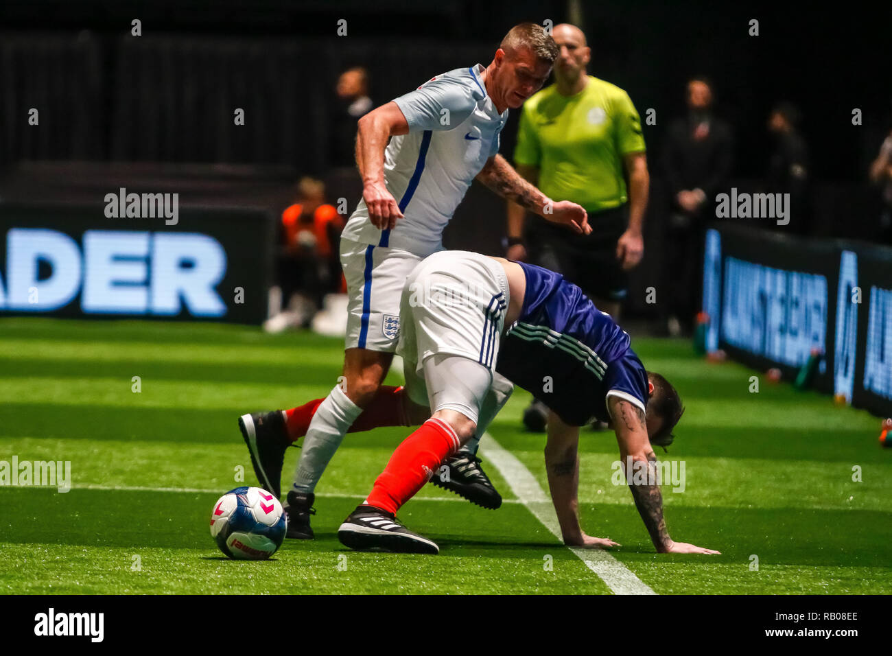 Glasgow, UK. 5th Jan 2019. Action from Day 2 of the FansBet Star Sixes Tournament at the SSE Hydro in Glasgow.    Game 6 - England Vs Scotland Both Paul Konchesky (ENG) & James McFadden (SCO) were determined not to loose the ball during the Star Sixes Tournament in Glasgow Credit: Colin Poultney/Alamy Live News Stock Photo