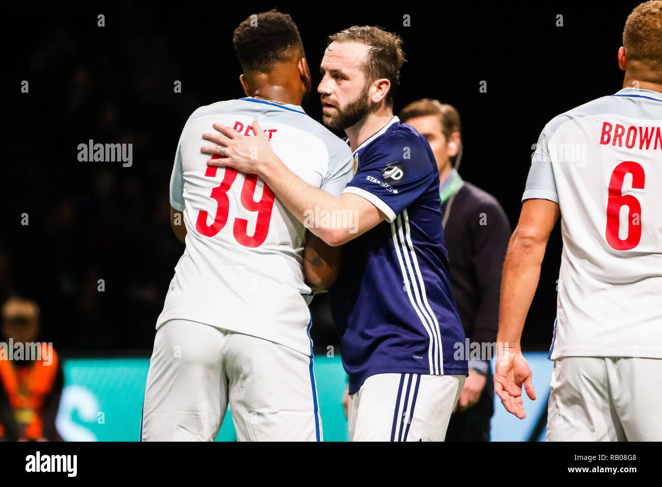 Glasgow, UK. 5th Jan 2019. Action from Day 2 of the FansBet Star Sixes Tournament at the SSE Hydro in Glasgow.    Game 6 - England Vs Scotland 'Its Only A Game' Darren Bent congratulates James McFadden during the Star Sixes Tournament in Glasgow Credit: Colin Poultney/Alamy Live News Stock Photo