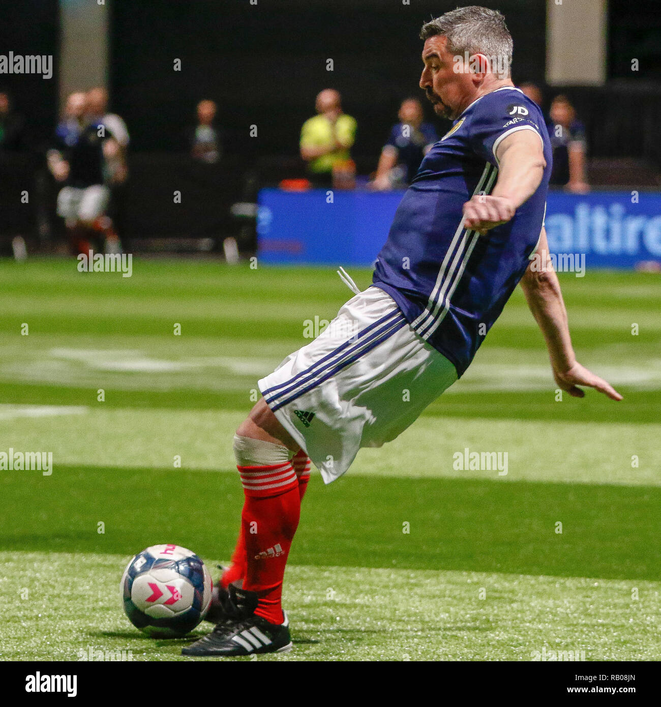 Glasgow, UK. 5th Jan 2019. Action from Day 2 of the FansBet Star Sixes Tournament at the SSE Hydro in Glasgow.     Game 2 - Wales Vs Scotland Charlie Miller doubles Scotlands lead with a close range strike during the Star Sixes Tournament in Glasgow Credit: Colin Poultney/Alamy Live News Stock Photo
