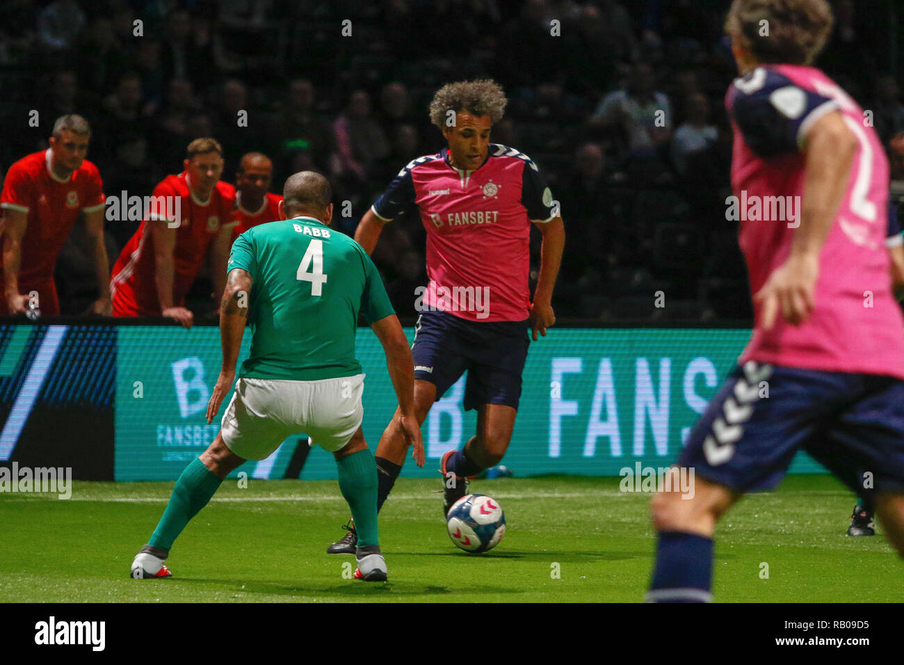 Glasgow, UK. 5th Jan 2019. Action from Day 2 of the FansBet Star Sixes Tournament at the SSE Hydro in Glasgow.   Game 1 - Rest Of the World Vs Republic Of Ireland Pierre Van Hooijdonk takes on Phil Babb during the Star Sixes Tournament in Glasgow Credit: Colin Poultney/Alamy Live News Stock Photo