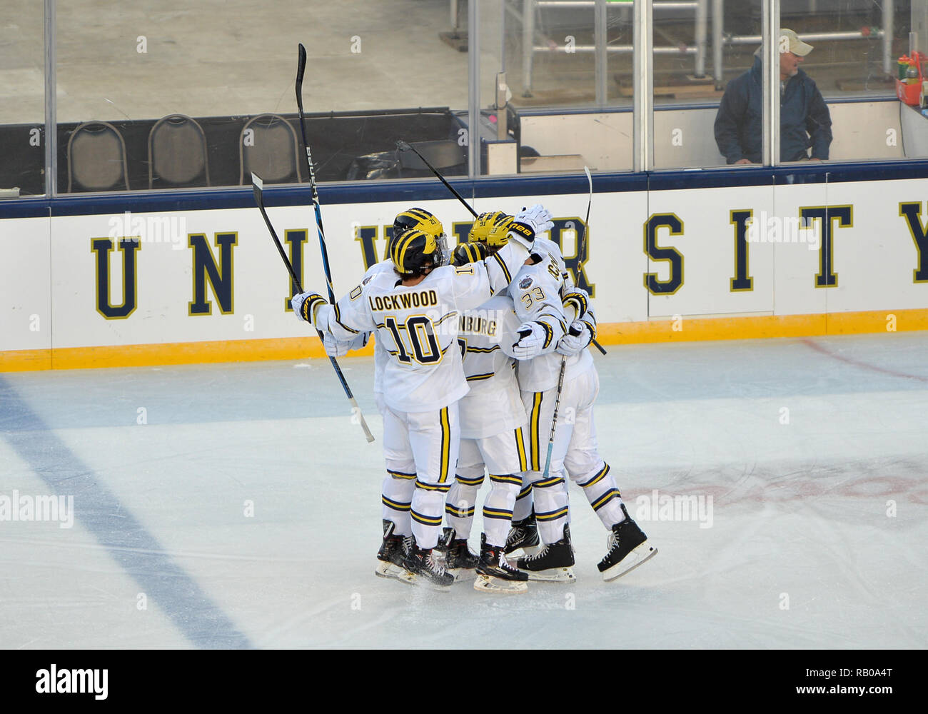 Indiana, USA USA. 05th Jan, 2019. Michigan Wolverines defenseman Joseph Cecconi (33) celebrates with his teams after scoring a goal during the 1st period Let's Take This Outside Meijer between the University of Michigan Wolverines and the University of Notre Dame Fighting Irish at Norte Dame Stadium in South Bend, IN. Michigan wins against Notre Dame, 4-2. Patrick Green/CSM/Alamy Live News Stock Photo