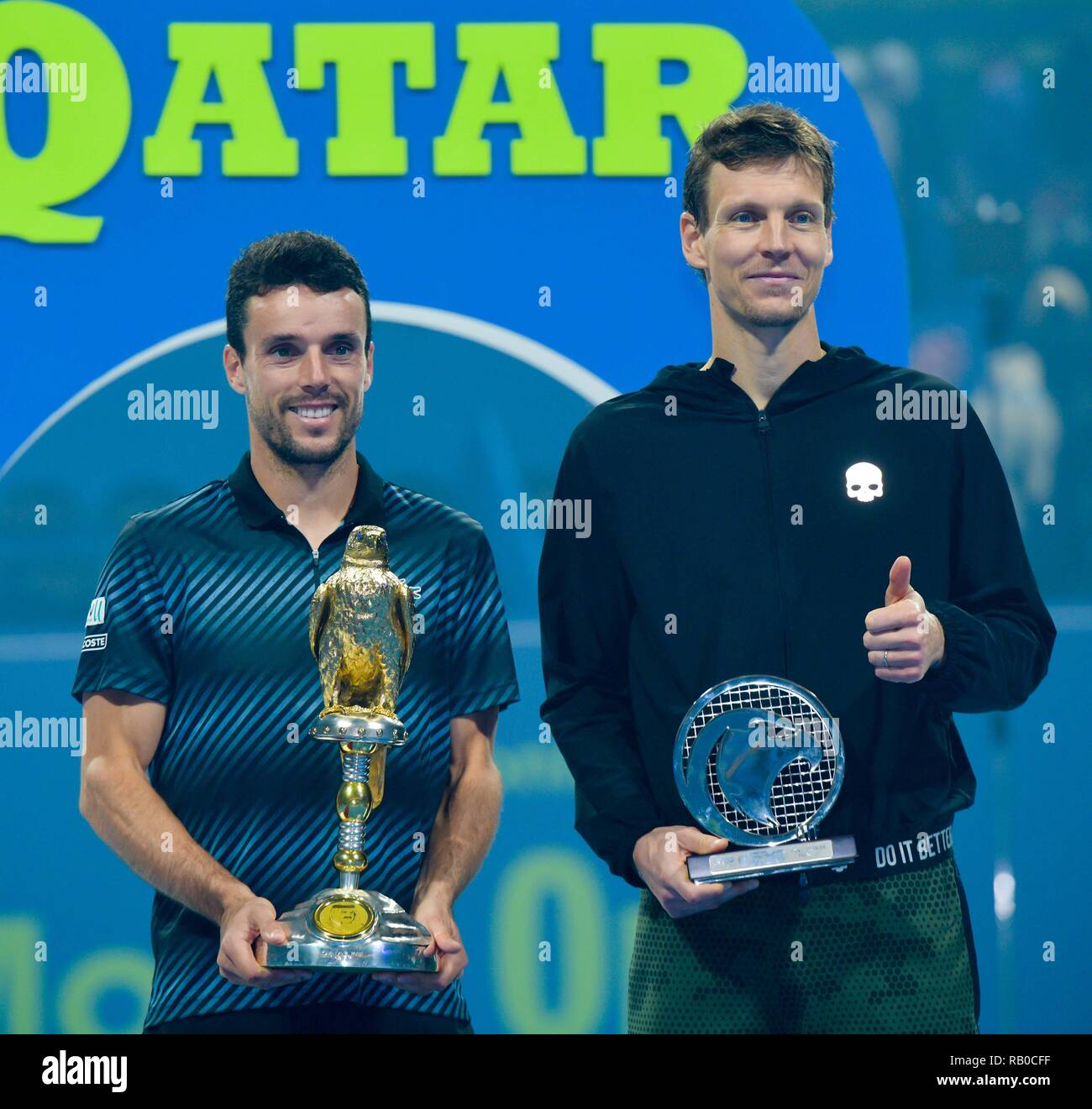 Doha, Qatar. 5th Jan, 2019. (SP)QATAR-DOHA-TENNIS-QATAR OPEN Spain's  Roberto Bautista Agut (L) and Tomas Berdych of Czech Republic pose with the  trophies after the final match at the ATP Qatar Open tennis