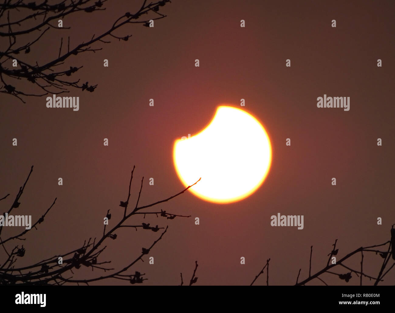 Jining, China's Shandong Province. 6th Jan, 2019. A partial solar eclipse is observed as the moon passes in front of the sun in Dashu Township of Zoucheng City, east China's Shandong Province, Jan. 6, 2019. Credit: Wang Qisheng/Xinhua/Alamy Live News Stock Photo
