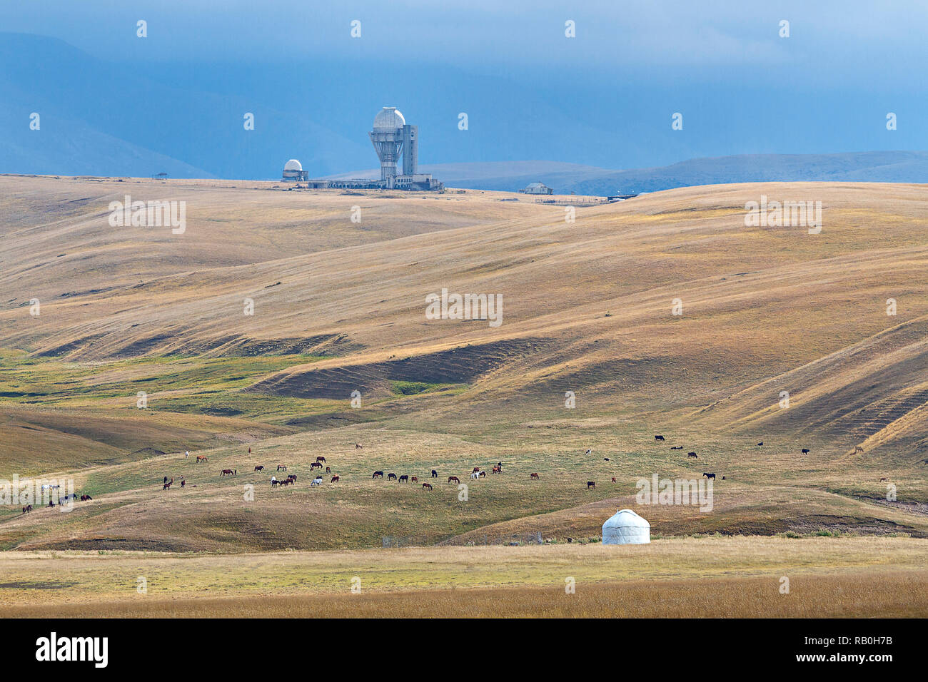 Assy plateau in Kazakhstan with abandoned Soviet observatory and a nomadic tent. Stock Photo