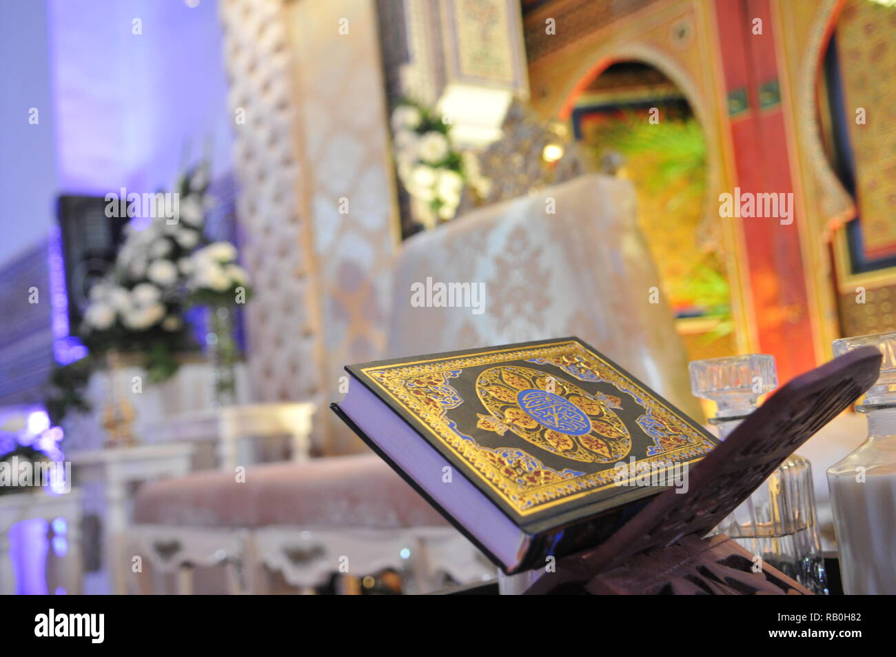 Quran, the holy book of islam on wooden stand Stock Photo