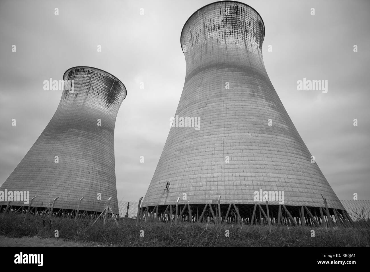 Dirty power station cooling towers Stock Photo