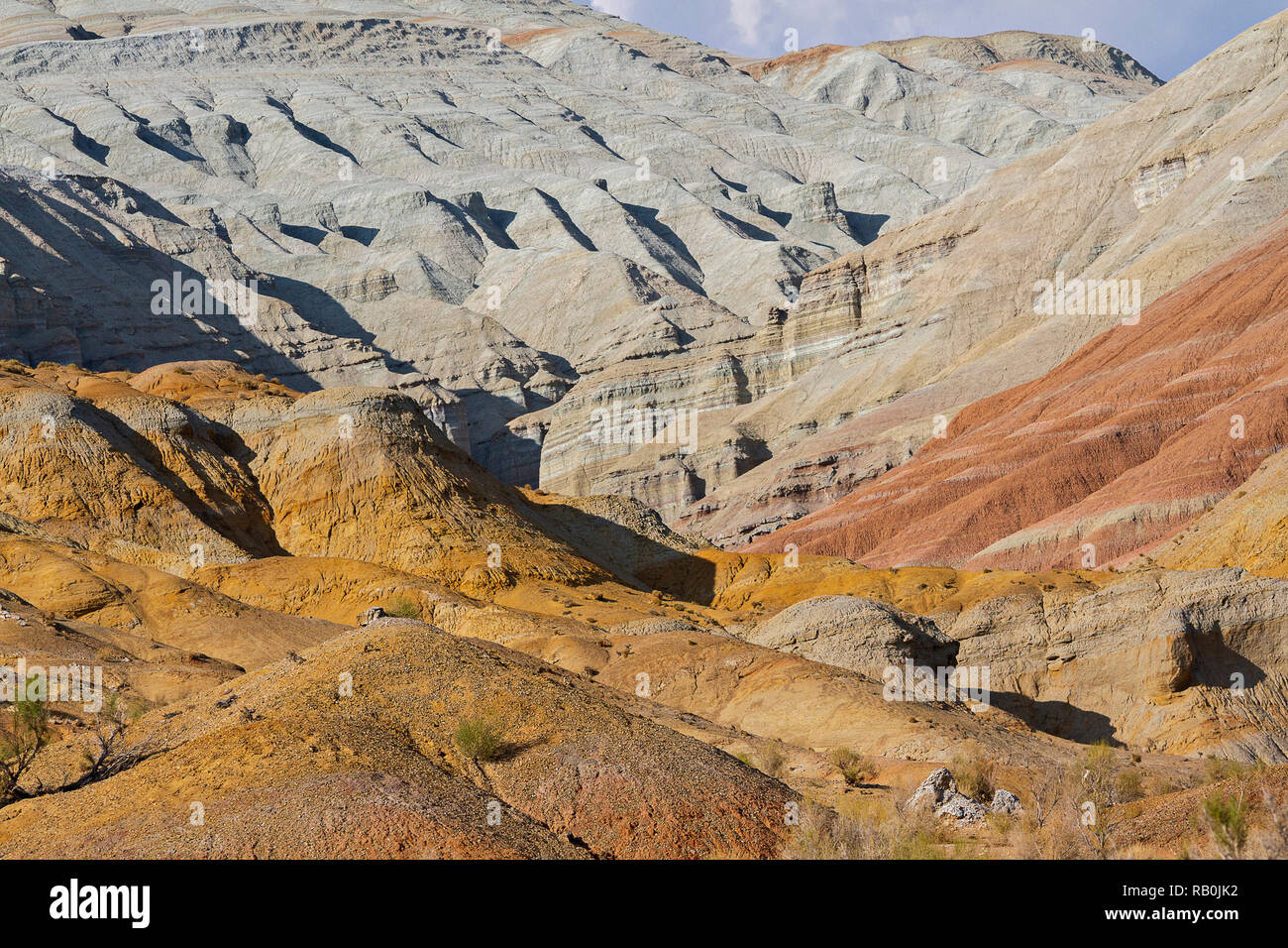 Rock formations and extreme terrain in the Aktau Mountains known also as White Mountains, in Kazakhstan Stock Photo