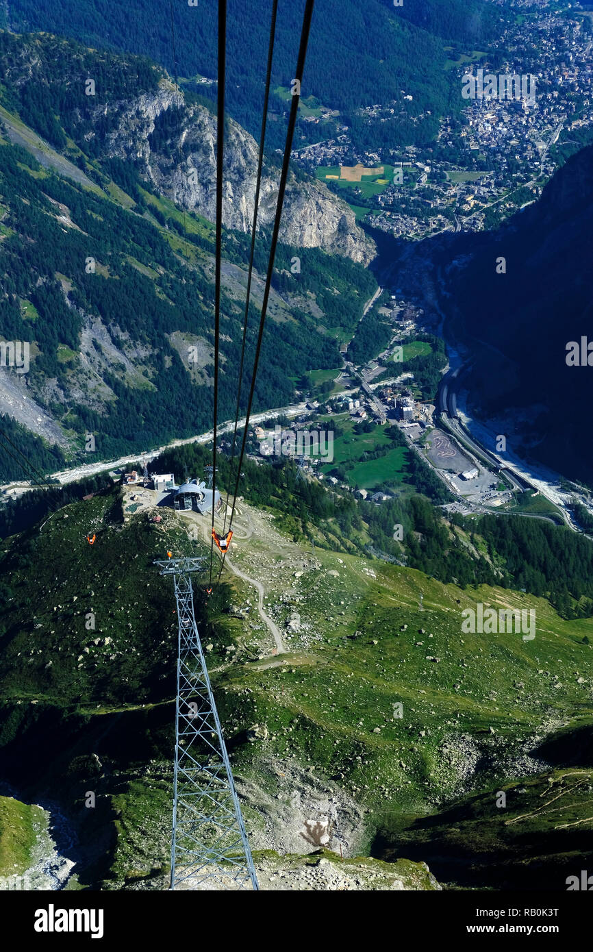 View from the Mont Blanc cable car on Courmayeur and Aosta Valley. The Skyway Monte Bianco cable car to Pointe Helbronner in the Mont Blanc massif. Stock Photo
