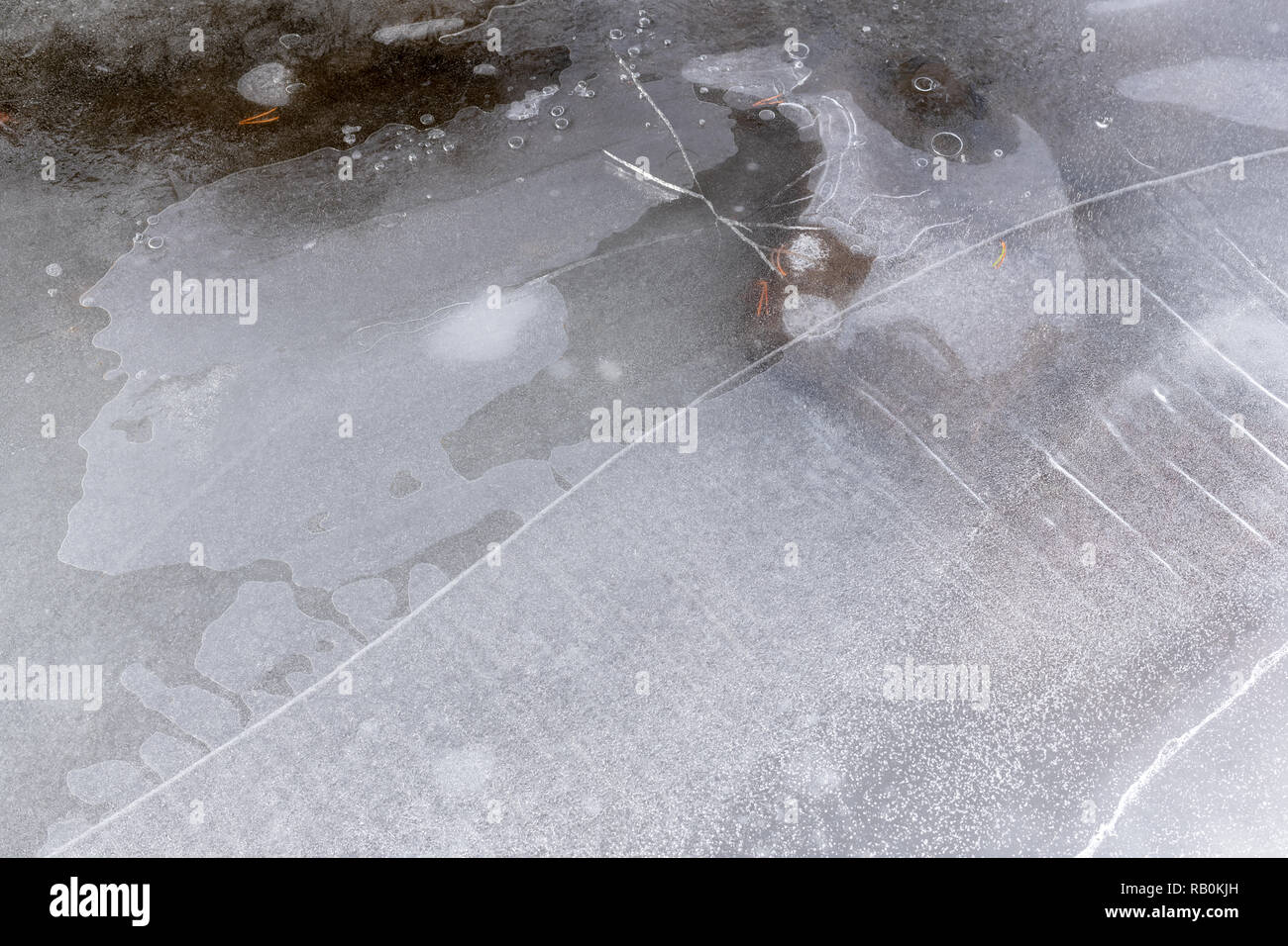Water under the surface of cracked ice on the Little Truckee River, California, USA Stock Photo
