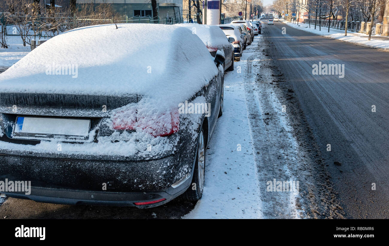 In the street side parked cars covered with snow Stock Photo - Alamy