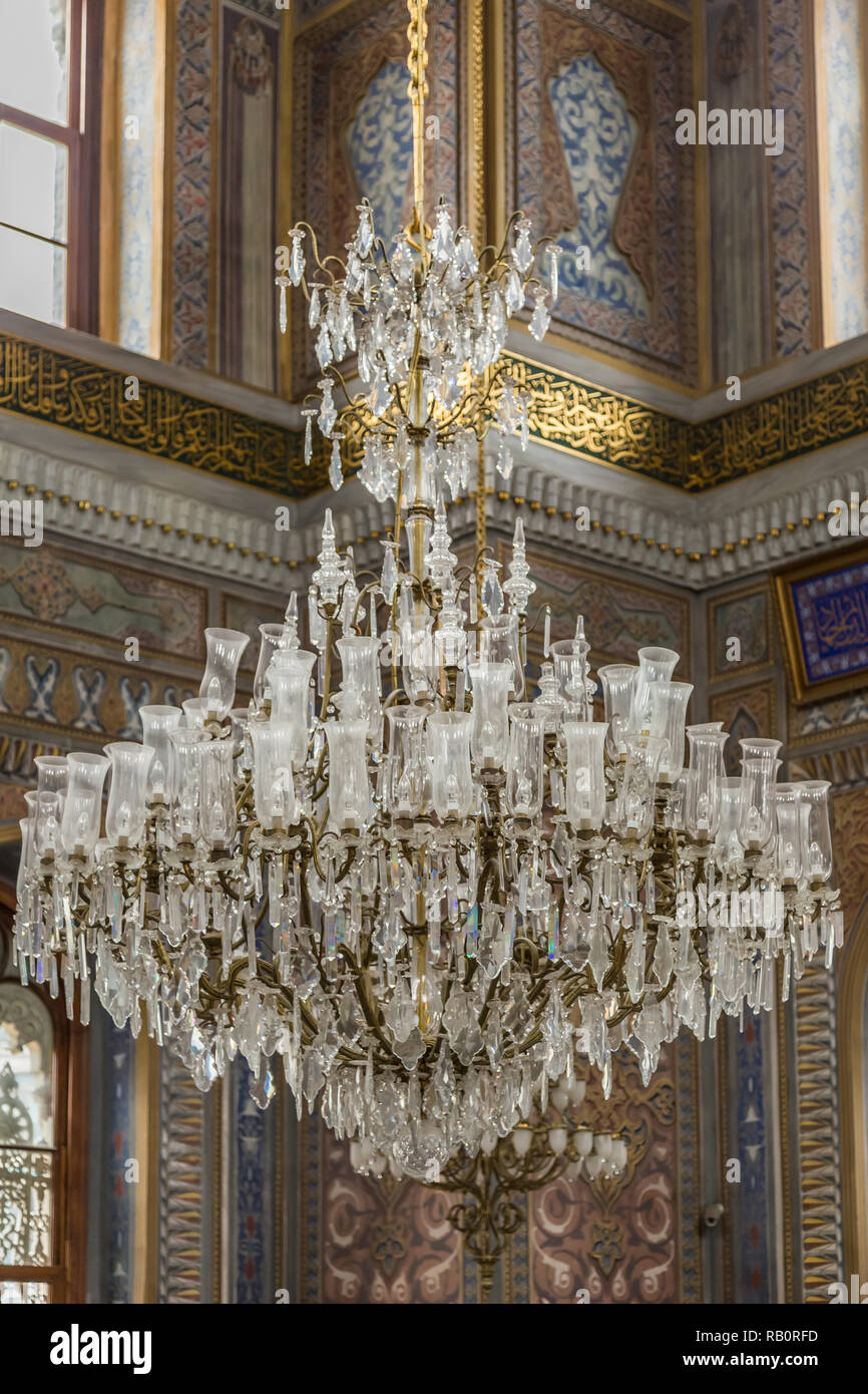 The interior of the Aksaray Mosque, Laleli, Istanbul, Turkey, showing the ornate chandelier. Stock Photo