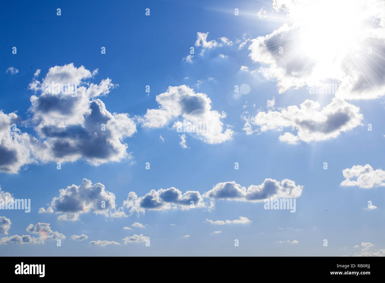 blue sky with sunbeams and clouds Stock Photo - Alamy