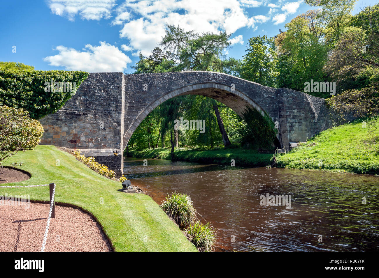 Medieval Brig O’Doon bridge spanning the River Doon at the Burns National Heritage Park in Alloway Scotland Stock Photo