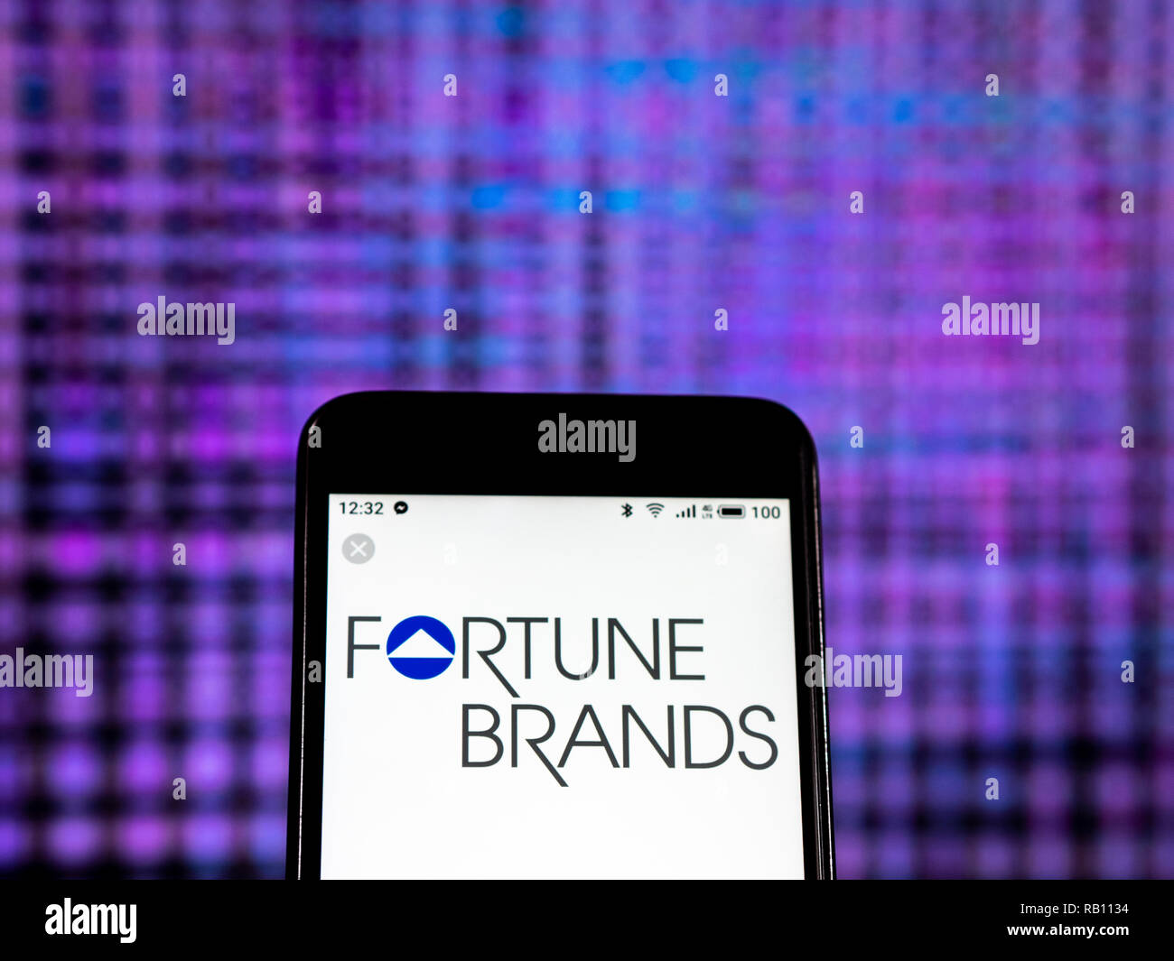 Fortune Brands Holding company logo seen displayed on smart phone Stock
