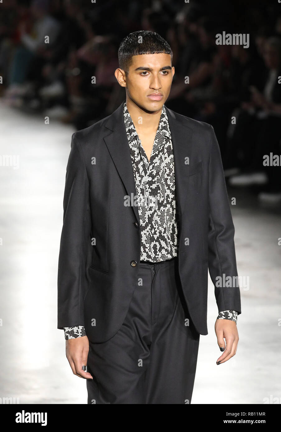 Models on the catwalk during the Edward Crutchley London Fashion Week