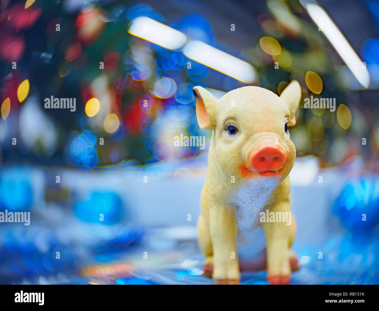 Christmas decorations and toys. Christmas and New Year festive soft-focused background with a pig as a symbol of the new year. Stock Photo