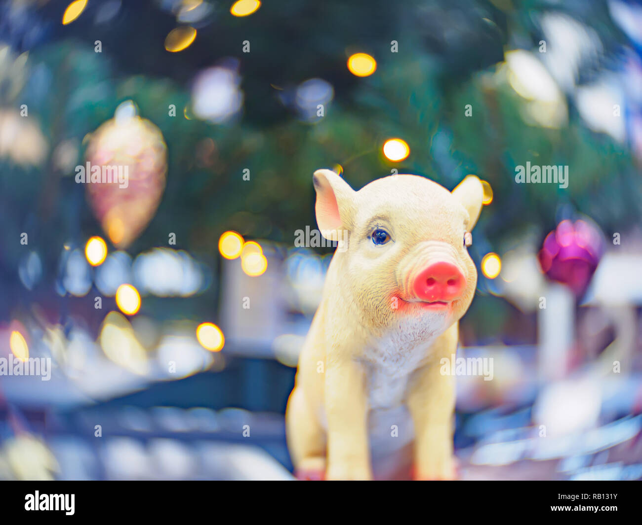 Christmas decorations and toys. Christmas and New Year festive soft-focused background with a pig as a symbol of the new year. Stock Photo