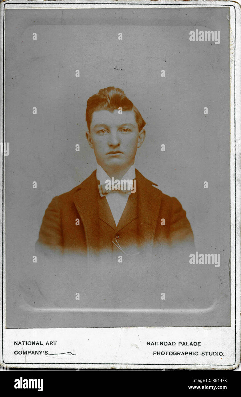 Cabinet Card Boy portrait By The Railroad Photographer.jpg - RB147X Stock Photo
