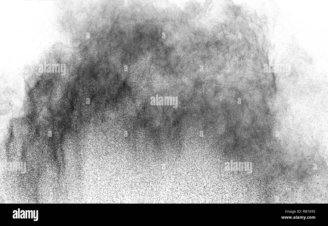 Closeup of black dust particles explode isolated on white background