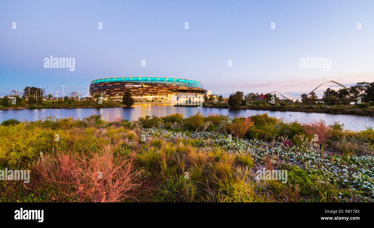 Optus Stadium surrounded by a lake and parkland. Stock Photo