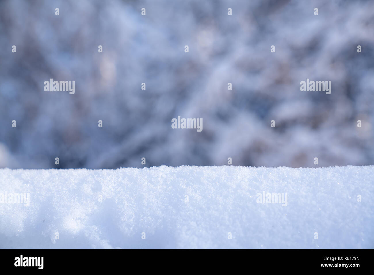 Christmas winter background with snow and blurred bokeh Stock Photo