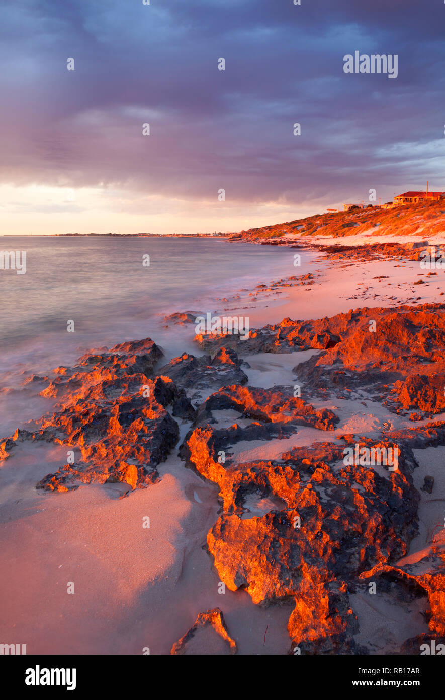 Limestone rocks at Watermans Bay at sunset.  Marmion Marine Park, Western Australia Stock Photo