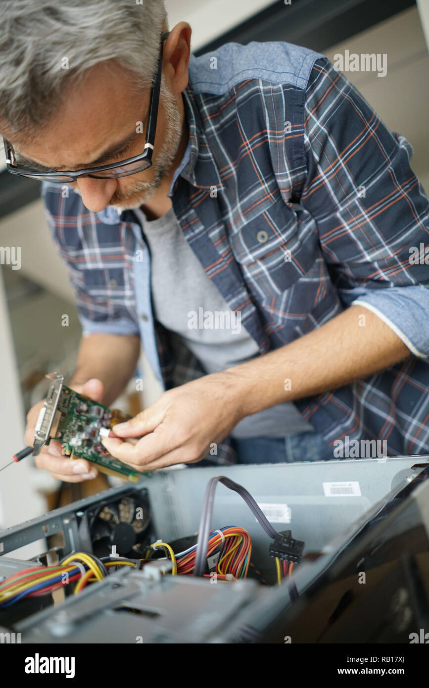 Technician repairing computer hardware Stock Photo Alamy