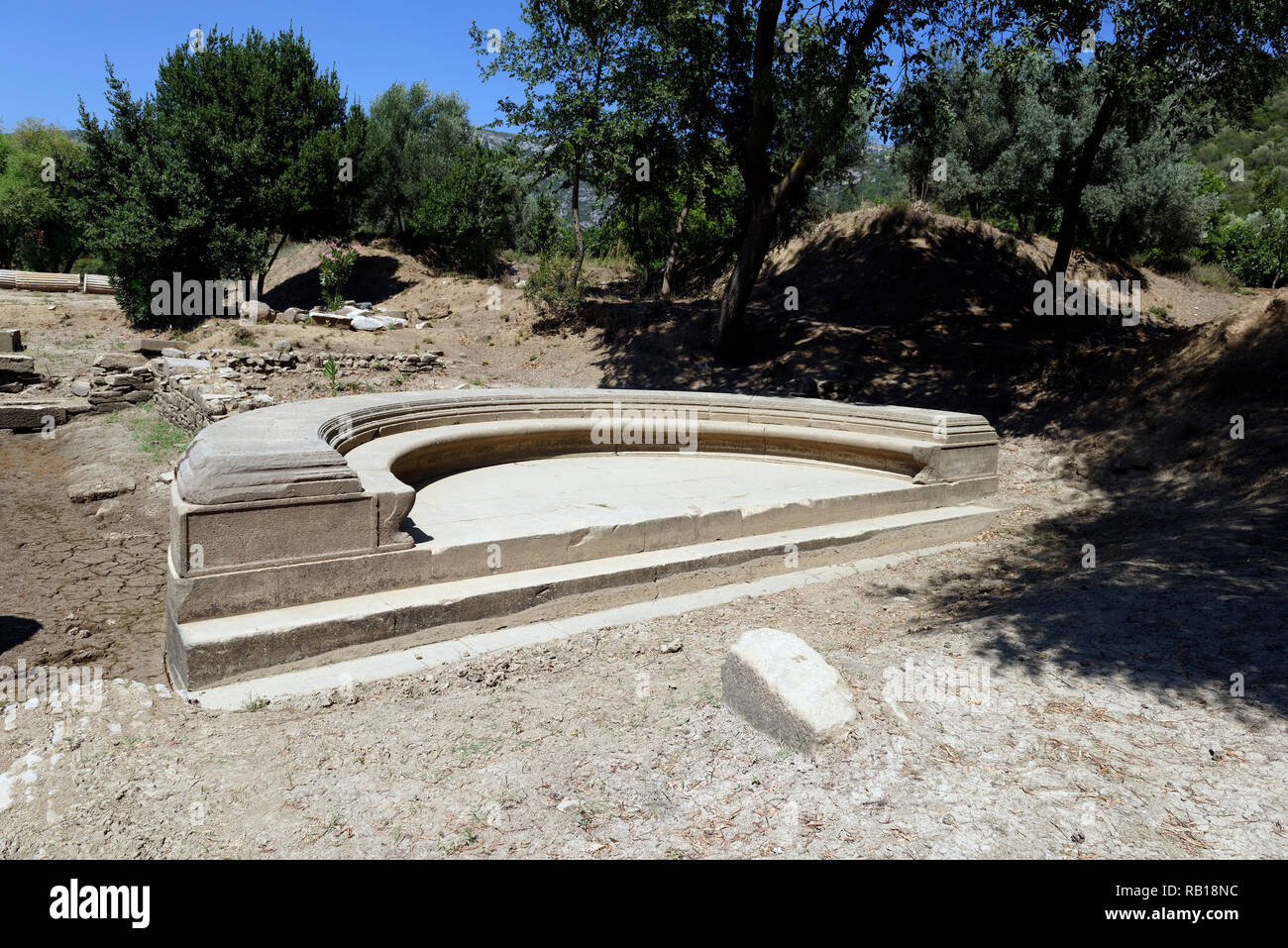 View of the Exedra, a semicircular recess where visitors sat and conversed. at the ancient Greek sanctuary of Apollo of Claros, Izmir province, Turkey Stock Photo