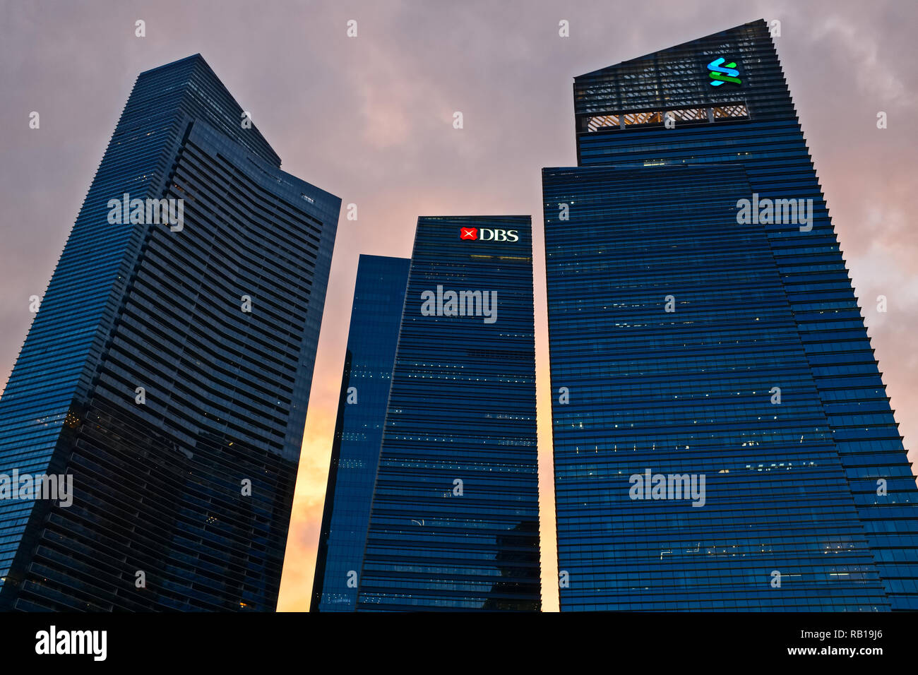 Sunset behind office towers at Marina Bay Financial Centre, including DBS Bank headquarters, Marina Boulevard, Marina Bay, Singapore Stock Photo