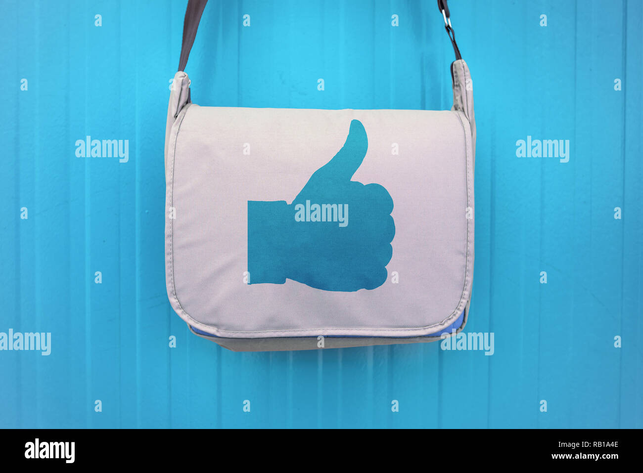 Like symbol on a bag with a hand giving the thumbs up sign. Stock Photo