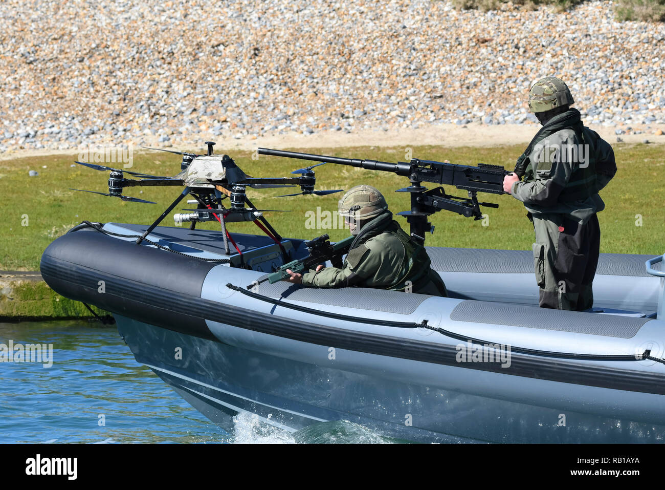 Military boat fitted with a military combat drone undergoing testing in a river in the UK. The boat was designed by Mike Ring of Ring Powercraft. Stock Photo