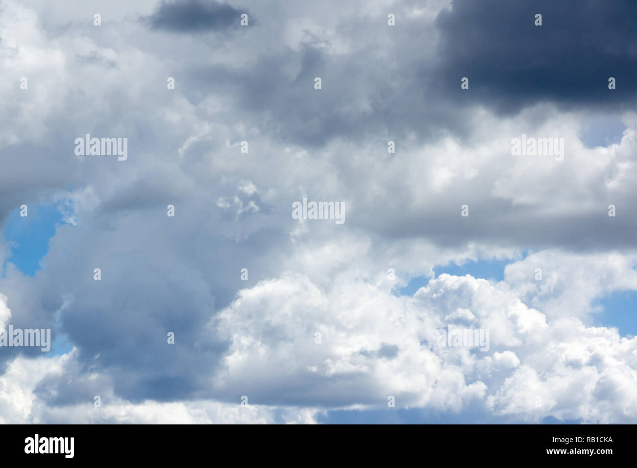 Blue sky with lots of white clouds Stock Photo - Alamy