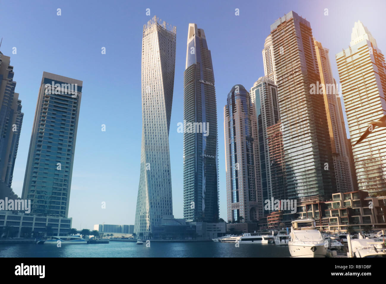 Sunrise over modern city skyline Stock Photo - Alamy
