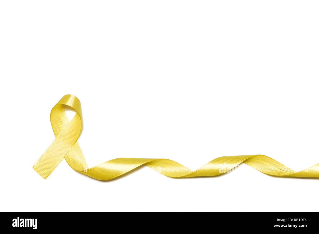 childhood gold ribbon as symbol of childhood cancer awareness isolated on white background Stock Photo