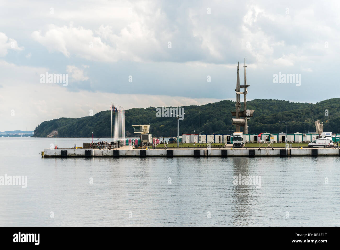 Gdynia, Poland, August 25, 2018; People walking along pier in Gdynia port in cloud day. Stock Photo