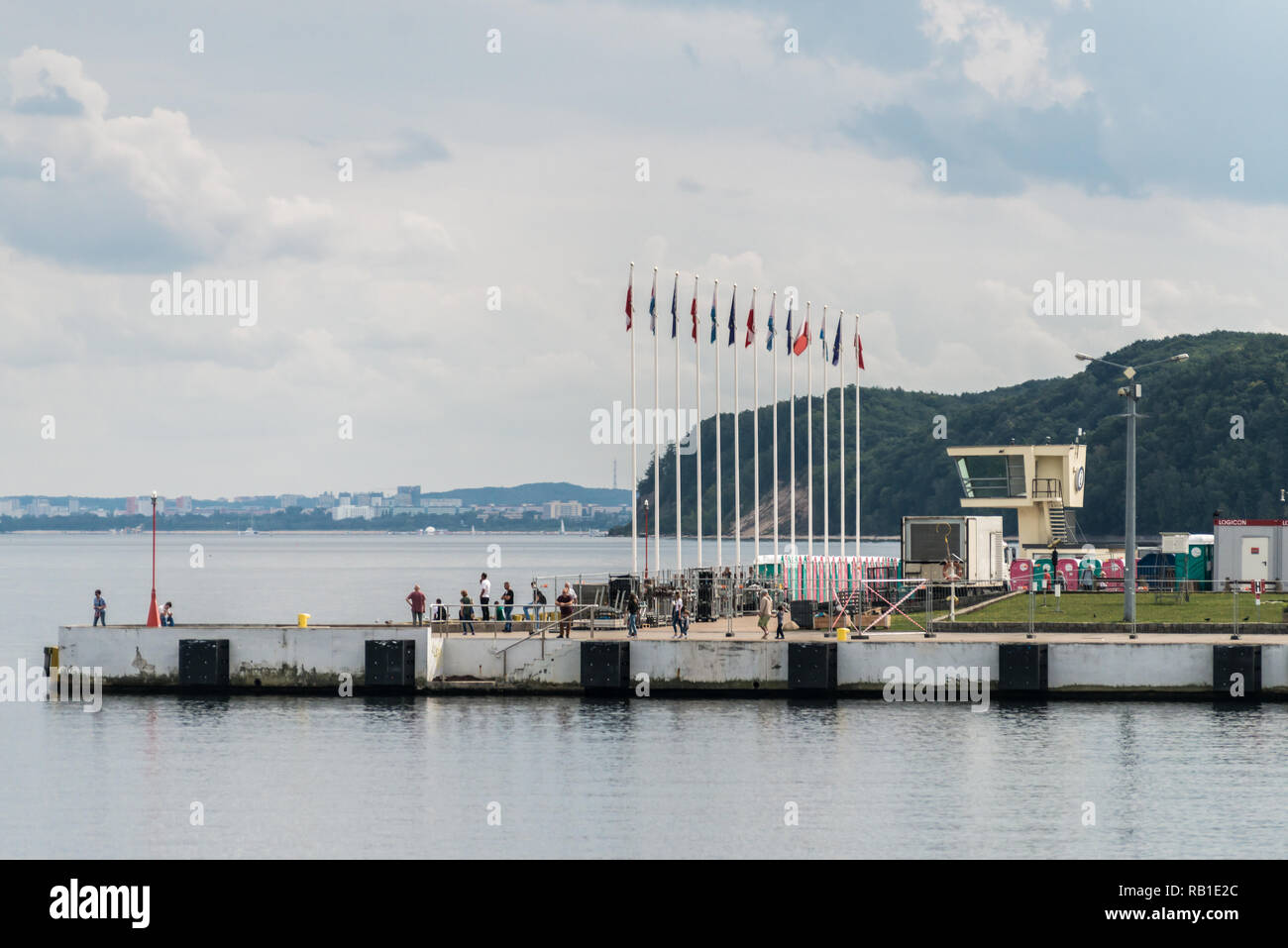 Gdynia, Poland, August 25, 2018; People walking along pier in Gdynia port in cloud day. Stock Photo