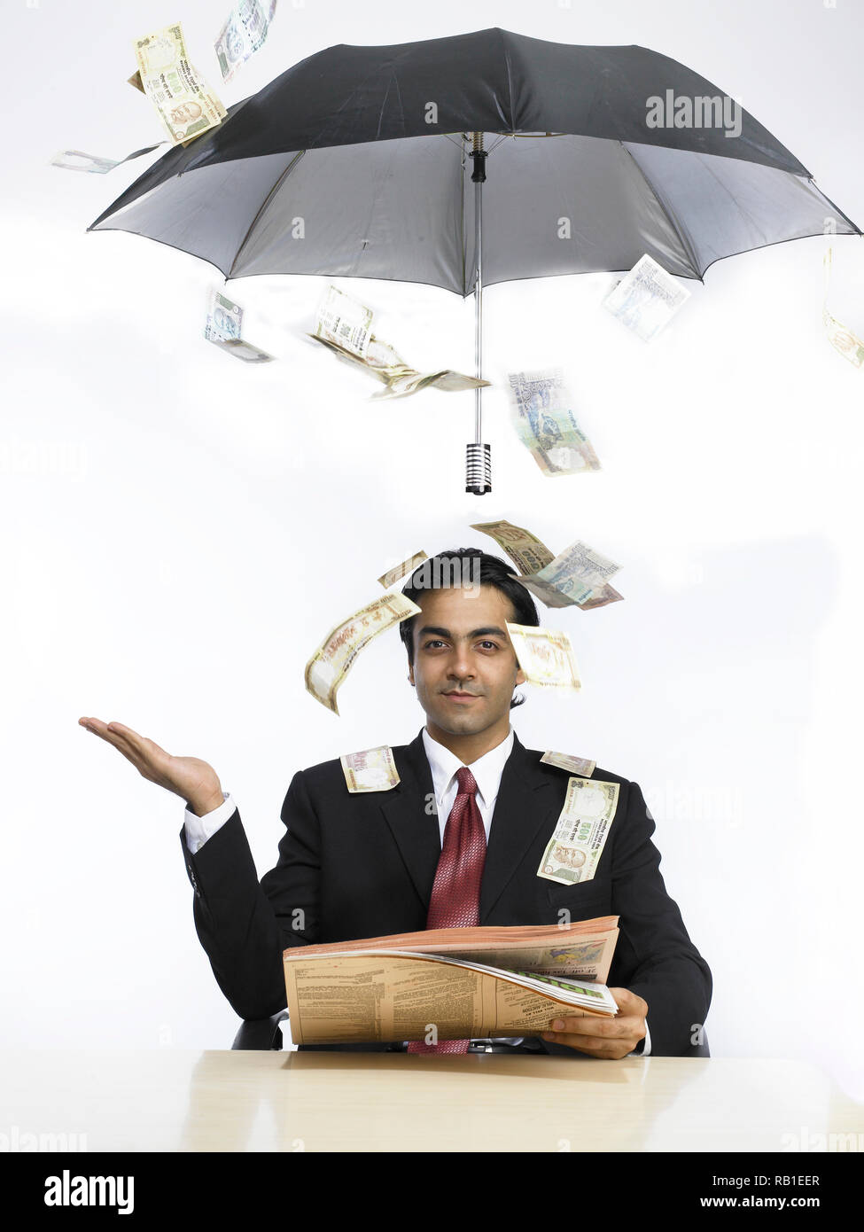 PORTRAIT OF A CORPORATE EXECUTIVE WITH MONEY RAINING DOWN Stock Photo ...