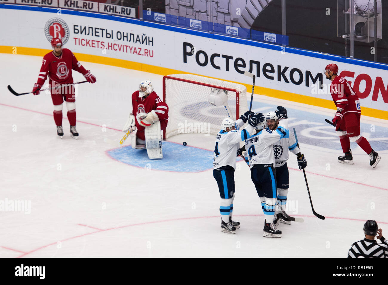 PODOLSK - SEPTEMBER 30, 2018 Players of Sibir team rejoice of a score on hockey game Vityaz vs Sibir Novosibirsk on Russia KHL championship on September 30, 2018, in Podolsk, Russia