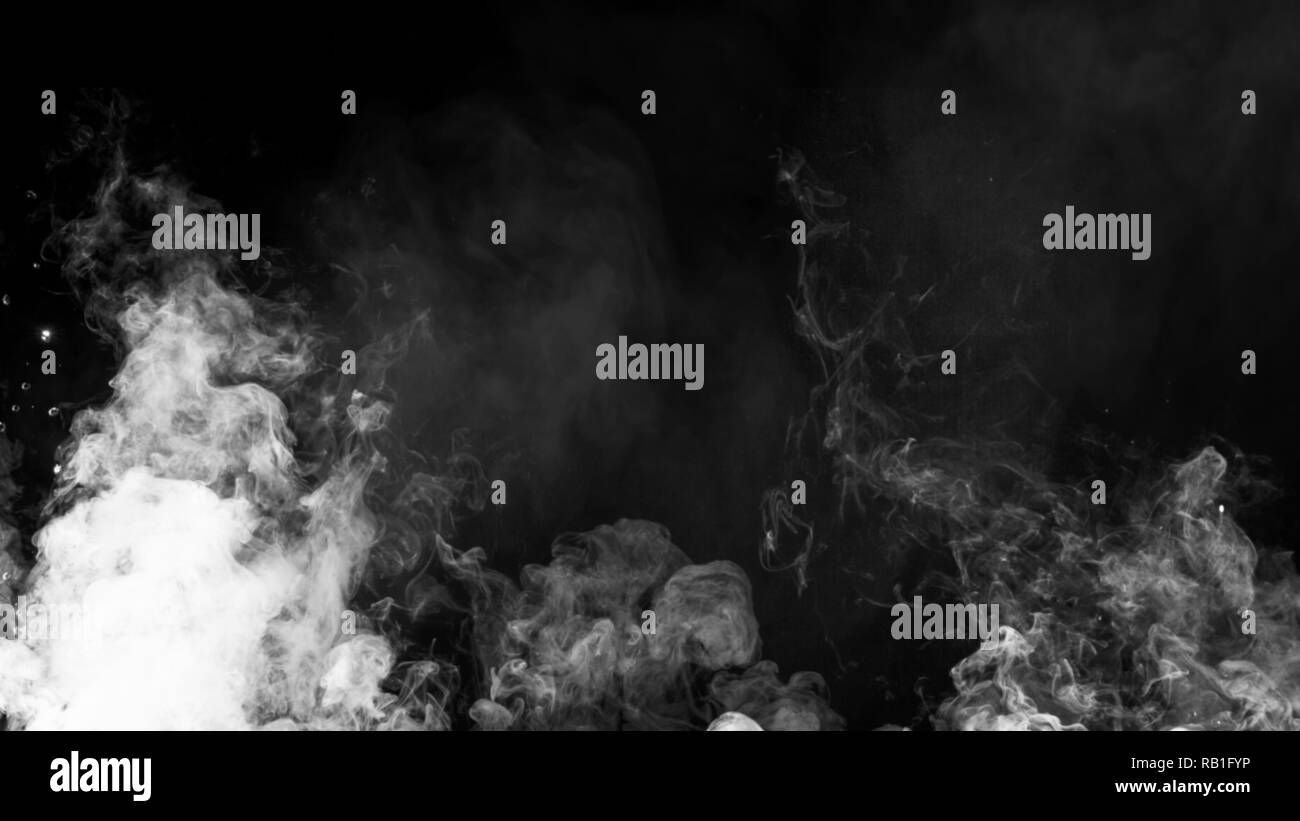 Smoke on floor . Isolated black background . Misty fog effect texture overlays for text or space Stock Photo