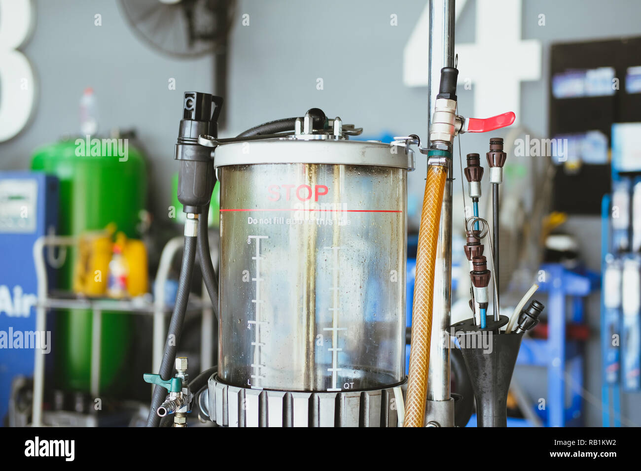 motor oil container for filling old engine oil from car in automobile